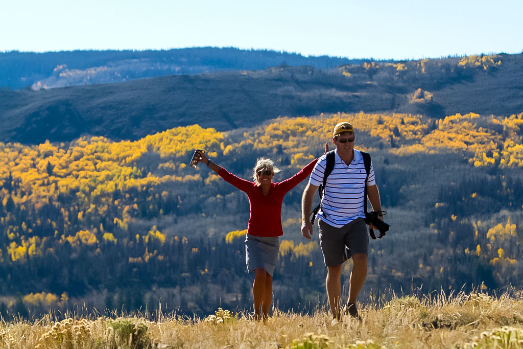 Hikers at C Lazy U Ranch reach the top of a hill.jpg